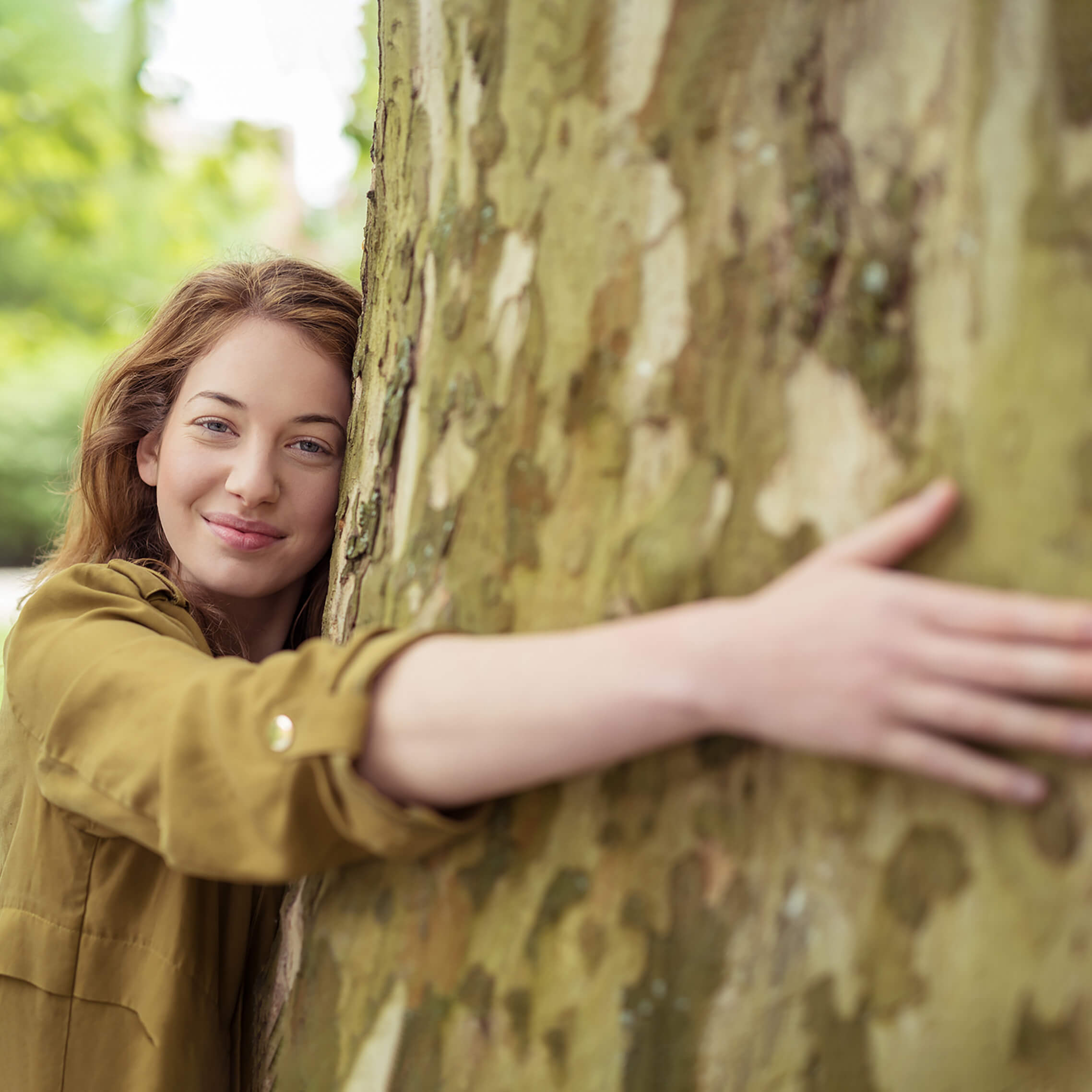 young-woman-hugging-a-tree-c