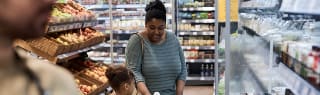 Mom-and-doughter-buying-grocery-Card
