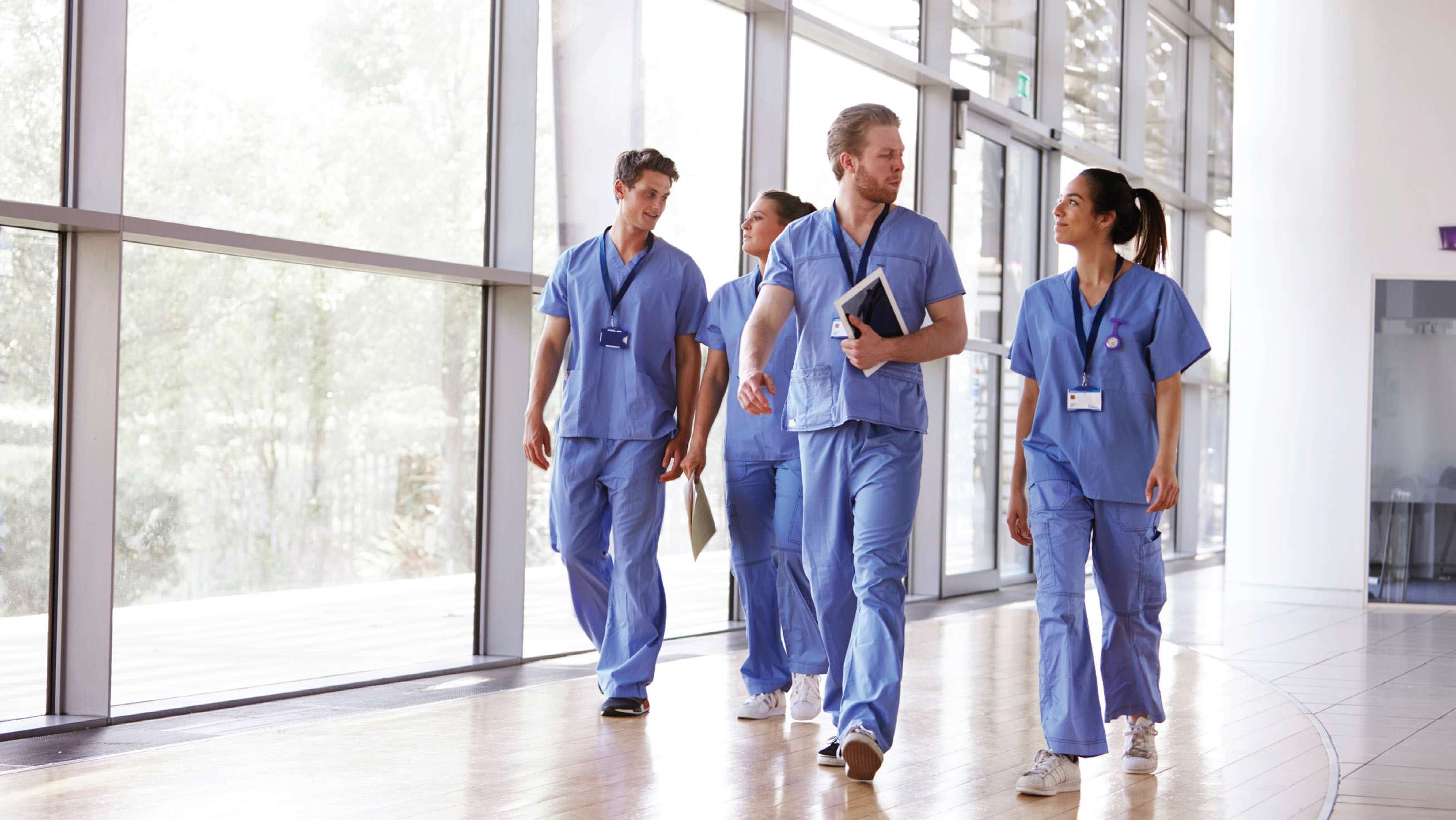 healthcare-workers-walking-in-hallway-16x9