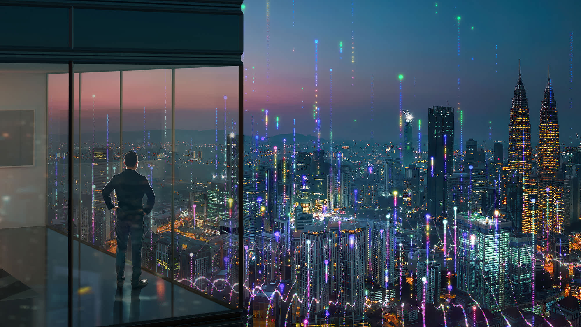 man-overlooking-digital-city-16x