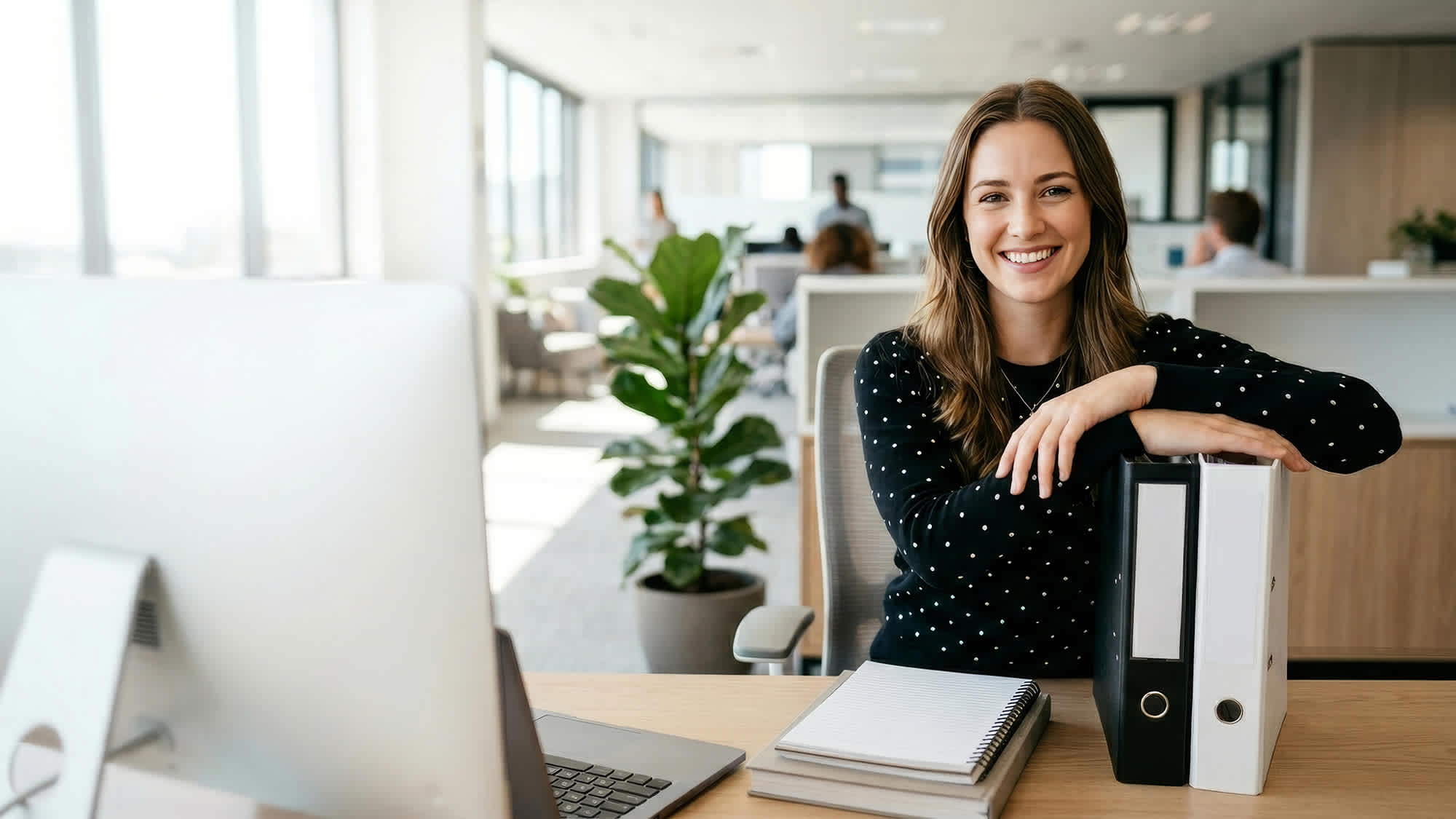 smiling-woman-in-financial-setting-16x9