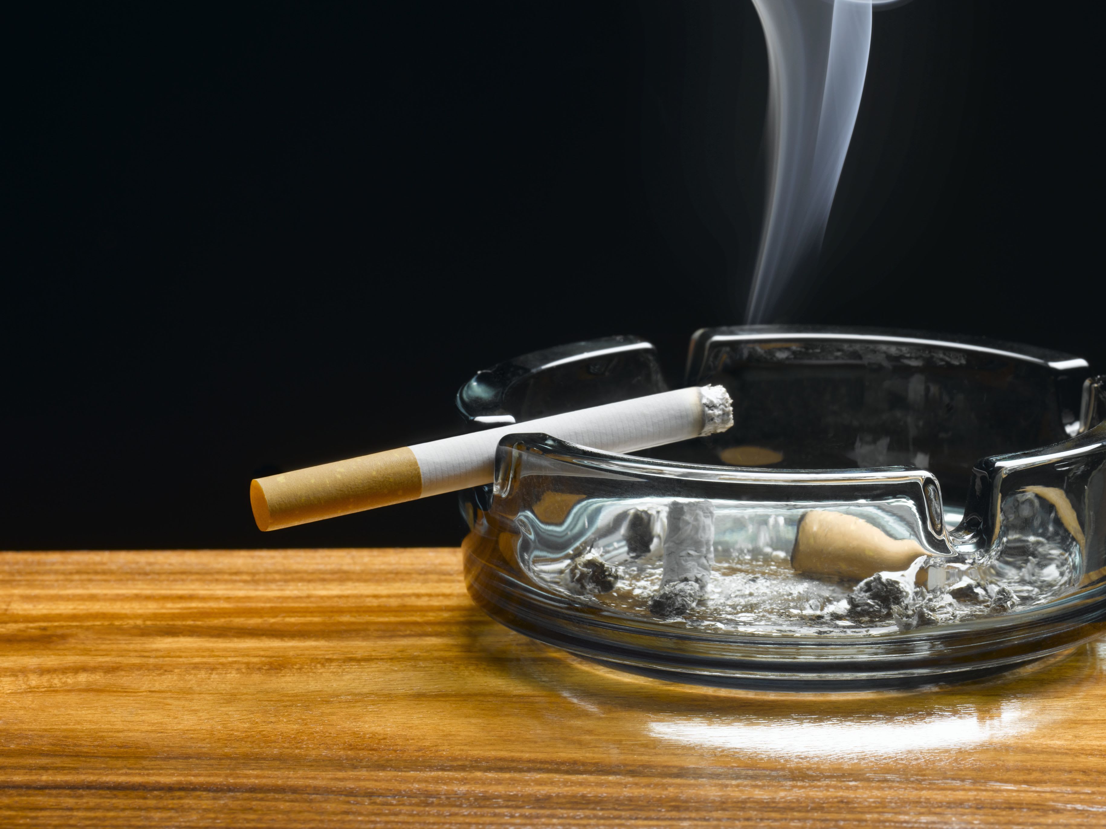 lit-cigarette-in-ashtray_4-3