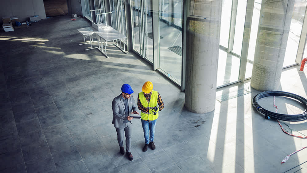 engineer-and-contractor-discussing-work-plans-16x9