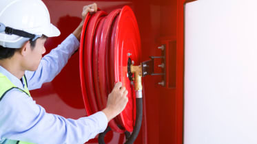 technician-checking-fire-hose_01_16x9