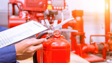 technician-clipboard-checking-fire-extinguisher-pressure_02_16x9