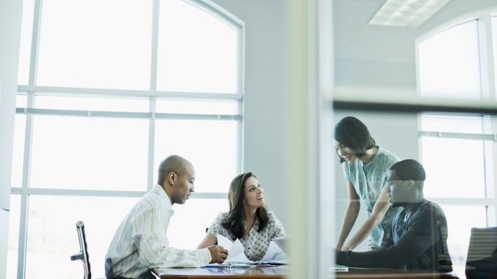 carrier-colleagues-working-together-in-conference-room