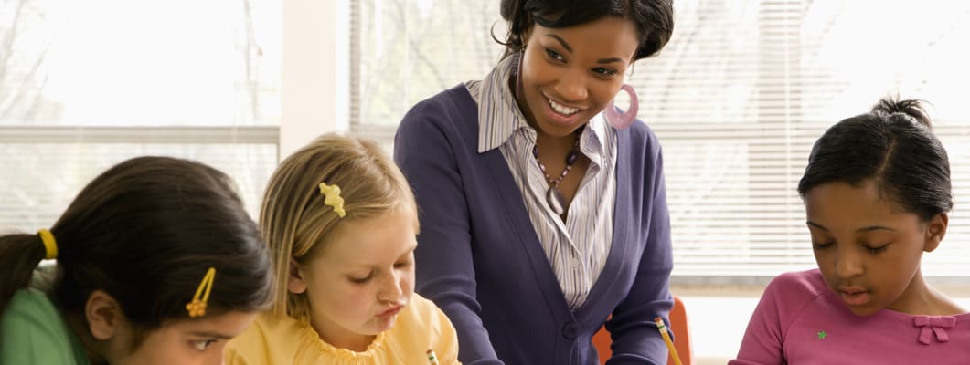 carrier-teacher-helping-young-children