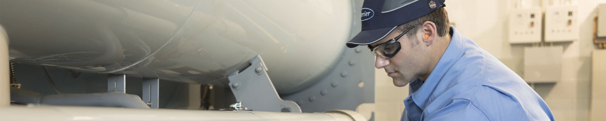 carrier-technician-testing-hvac-equipment-cropped-rev