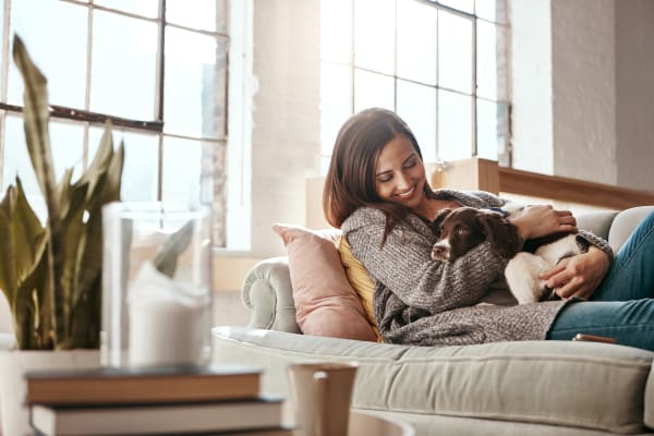 woman-and-dog-enjoying-healthy-indoor-air-quality-provided-by-cor-products