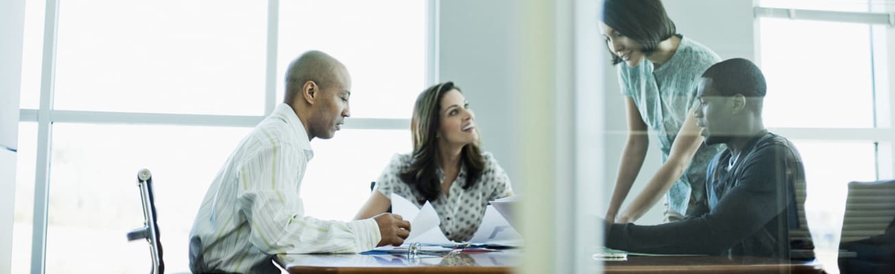 carrier-colleagues-working-together-in-conference-room-b