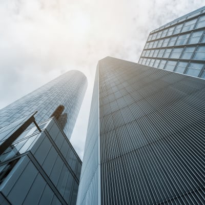 tall-office-buildings-looking-up-clouds_sq