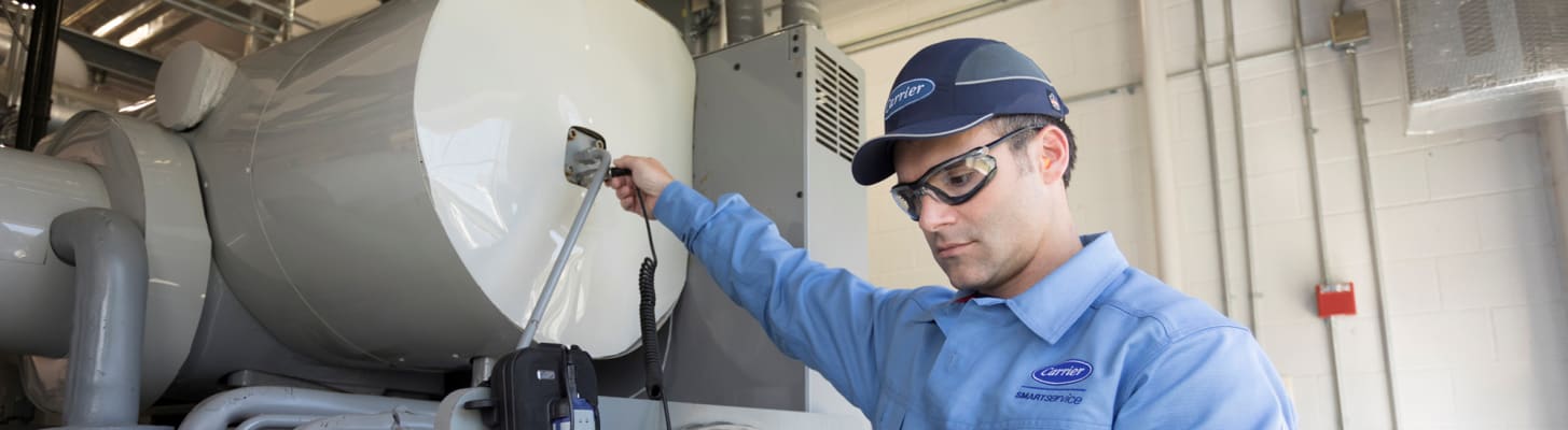 carrier-technician-evaluating-hvac-equipment_c