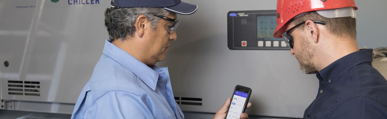 carrier-service-technicians-looking-at-mobile-phone-sm