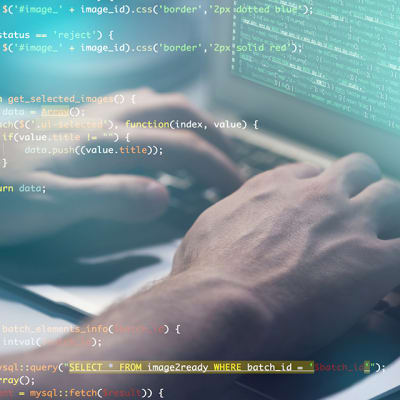 carrier-computer-programmer-at-keyboard-with-computer-code-mobile
