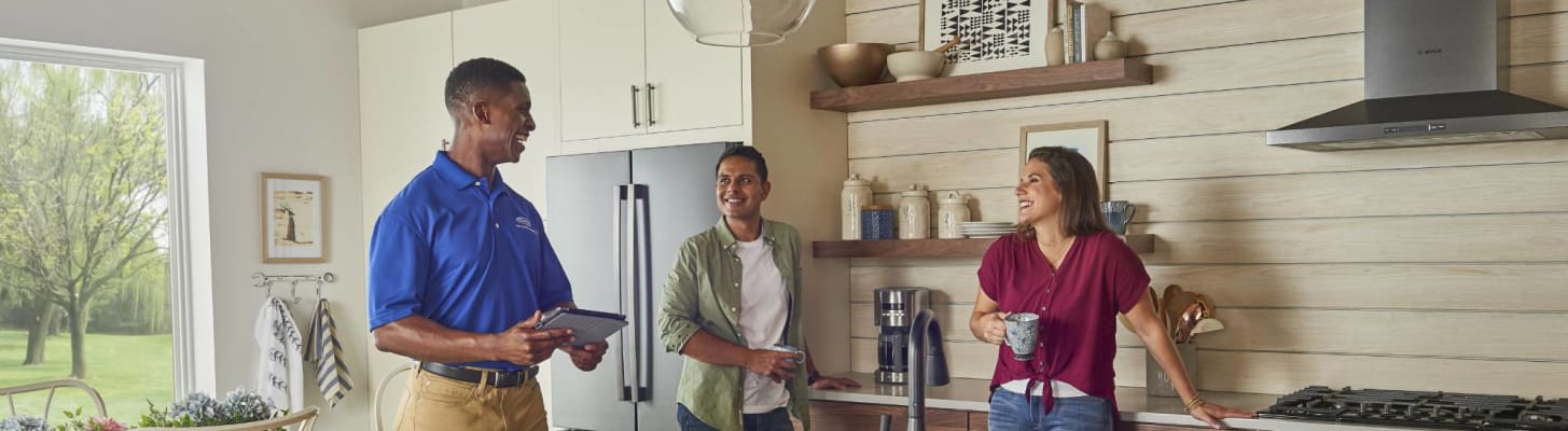 Carrier Dealer discussing heat pump cost