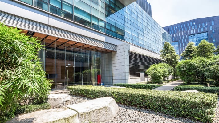carrier-modern-building-exterior-courtyard-with-trees-and-shrubbery