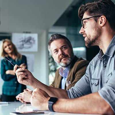 Engineers in meeting room discussing a project
