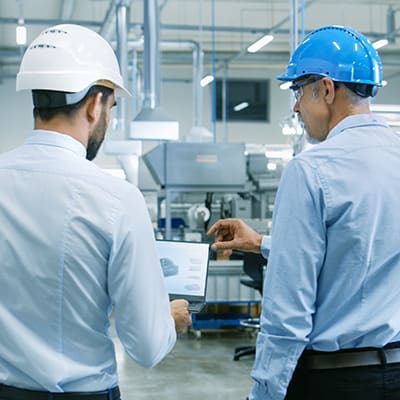 Two manufacturing engineers in a factor