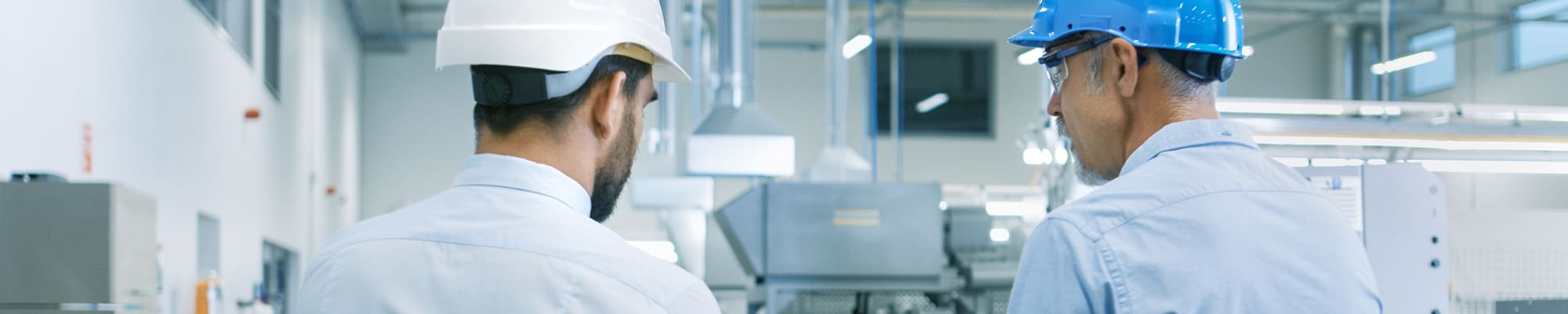 Two manufacturing engineers in a factor
