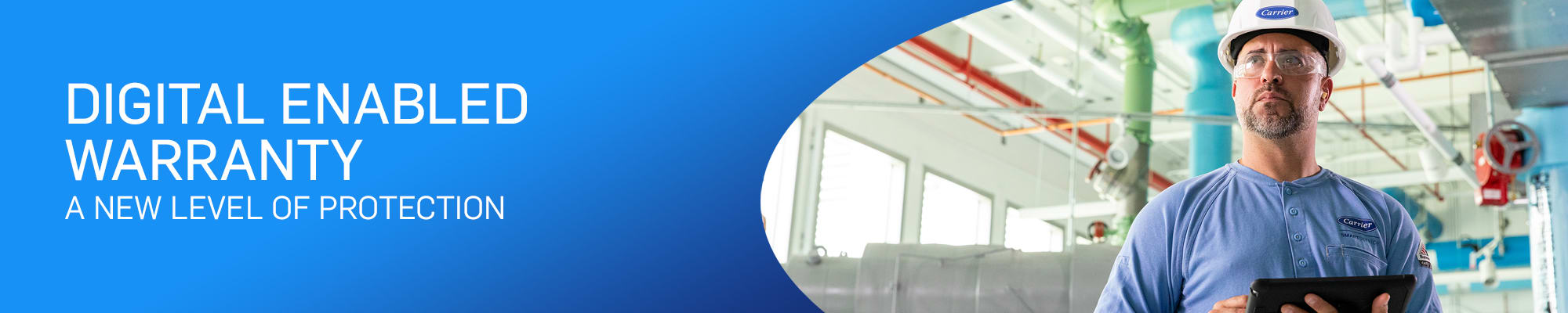 Certified Carrier Technician Wearing Carrier Safety Helmet and Goggles, Using Tablet to Help Commercial Client with Start-Up Services and Digital Enabled Warranty on HVAC Equipment
