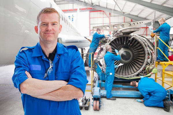 men-are-working-with-aircraft-engine