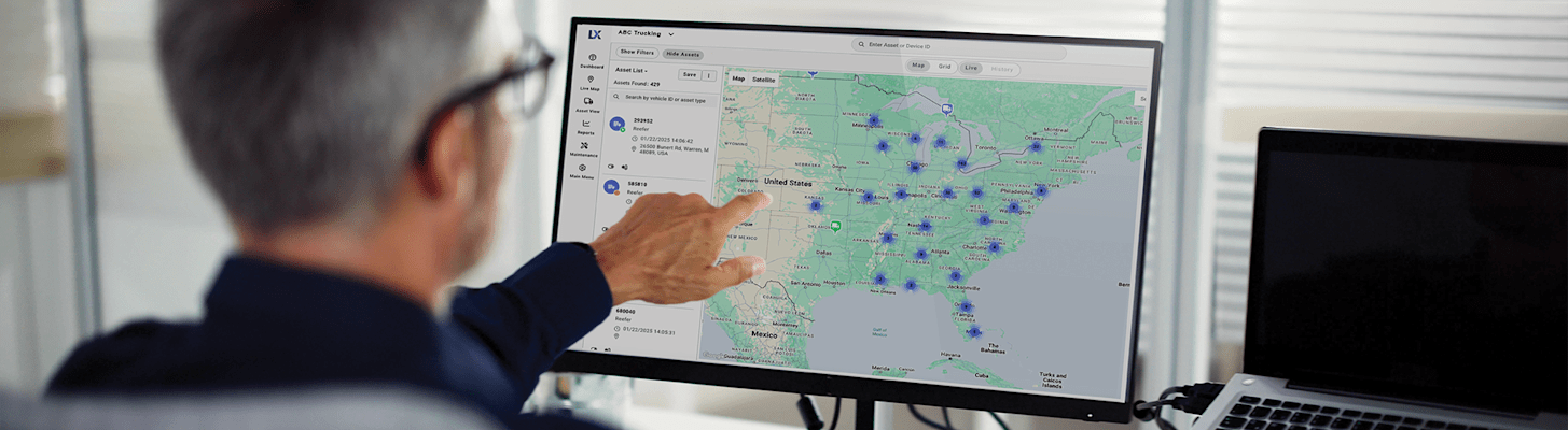 Man pointing at desktop screen of next generation Lynx Fleet telematics interface