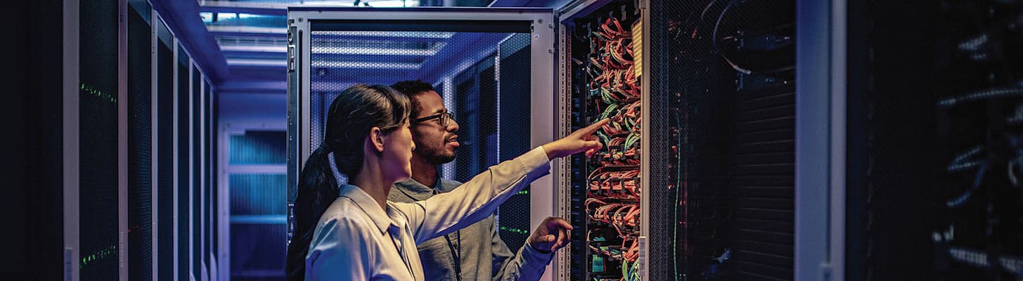 man-and-woman-in-a-data-center-h