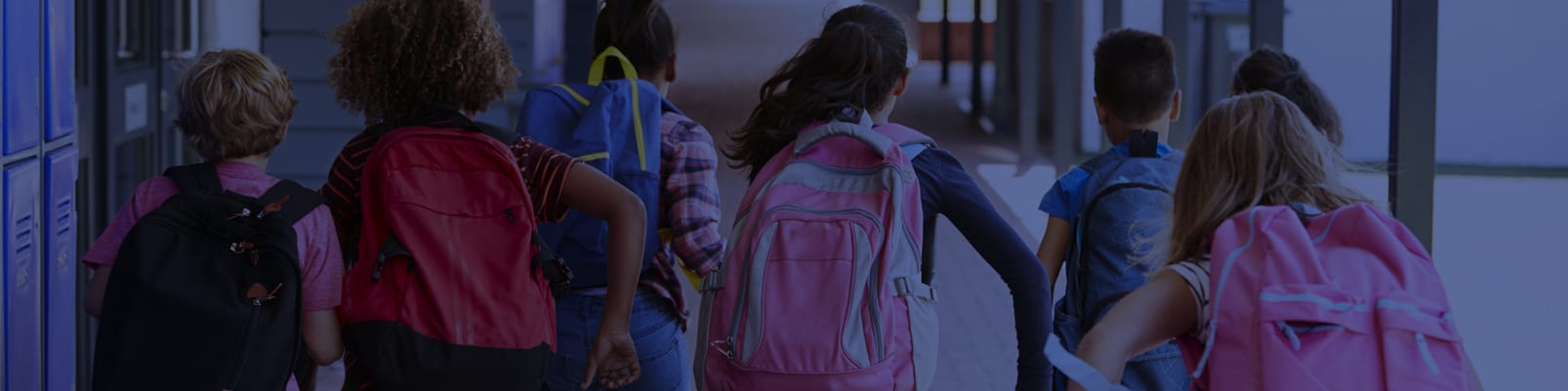 kids-running-outside-with-backpacks
