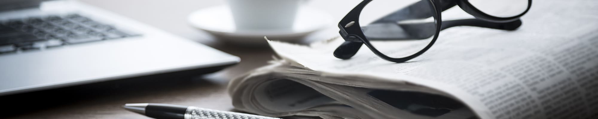 newspaper-with-reading-glasses-4x1