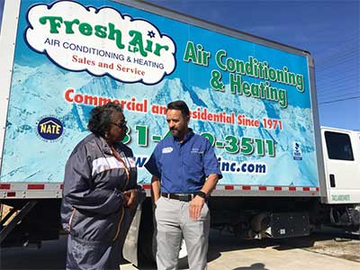 Sonny Roncancio, owner of Fresh Air, speaks with Ms. Roberson