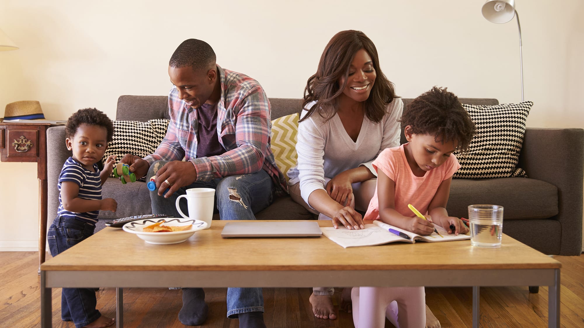 family-sitting-on-sofa-16x9