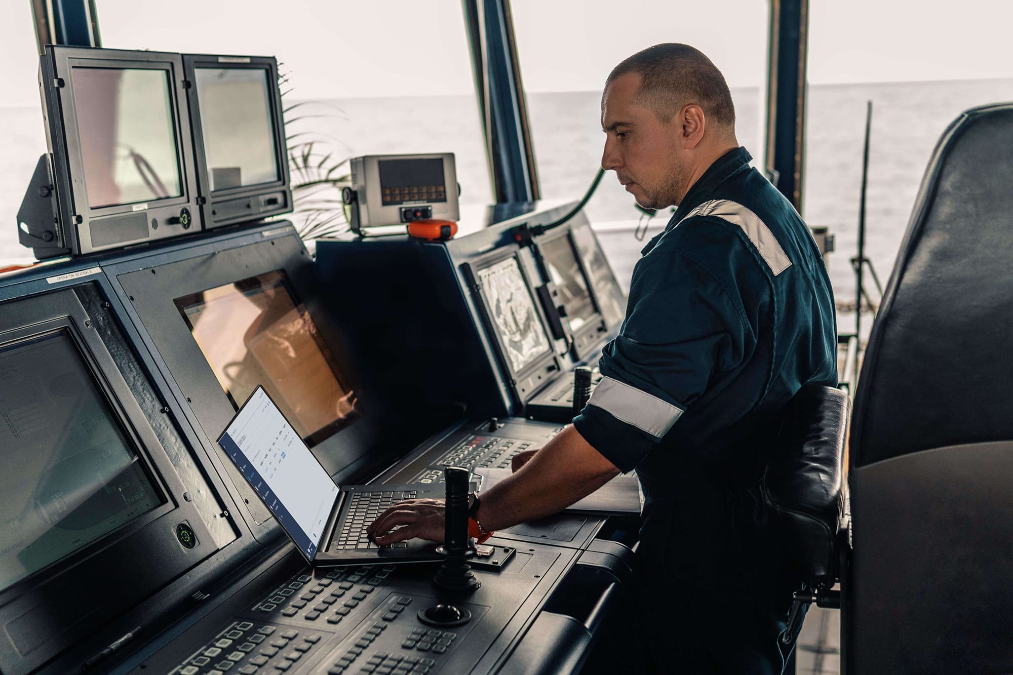 Person on ship using TripLINK to monitor containers