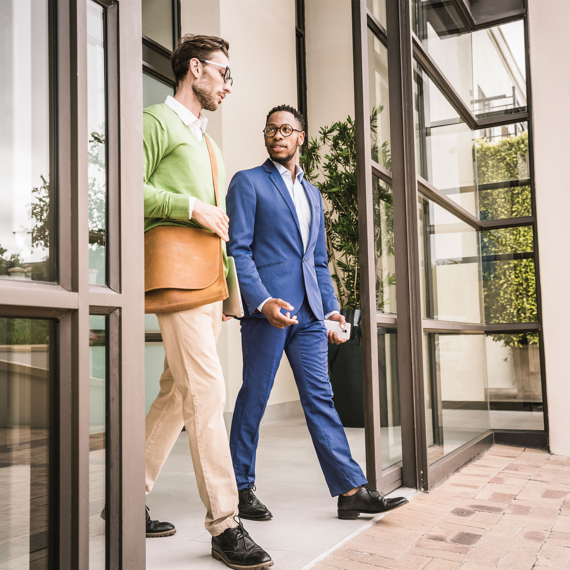 business-men-exiting-secure-door-1x1