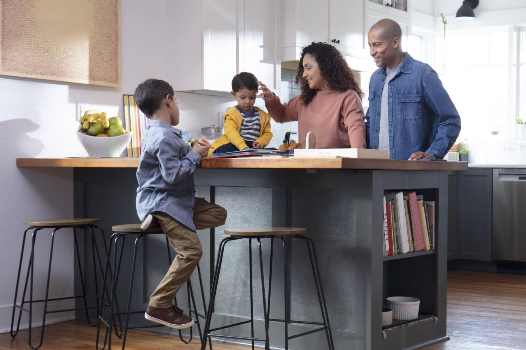 family-in-kitchen-green-cabinets-3x2