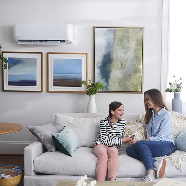 aunt-and-niece-hanging-out-on-the-couch-1x1