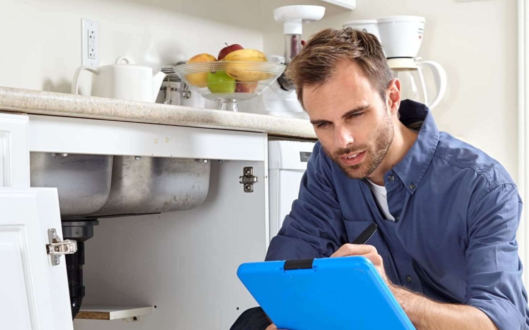 Male house inspector taking notes