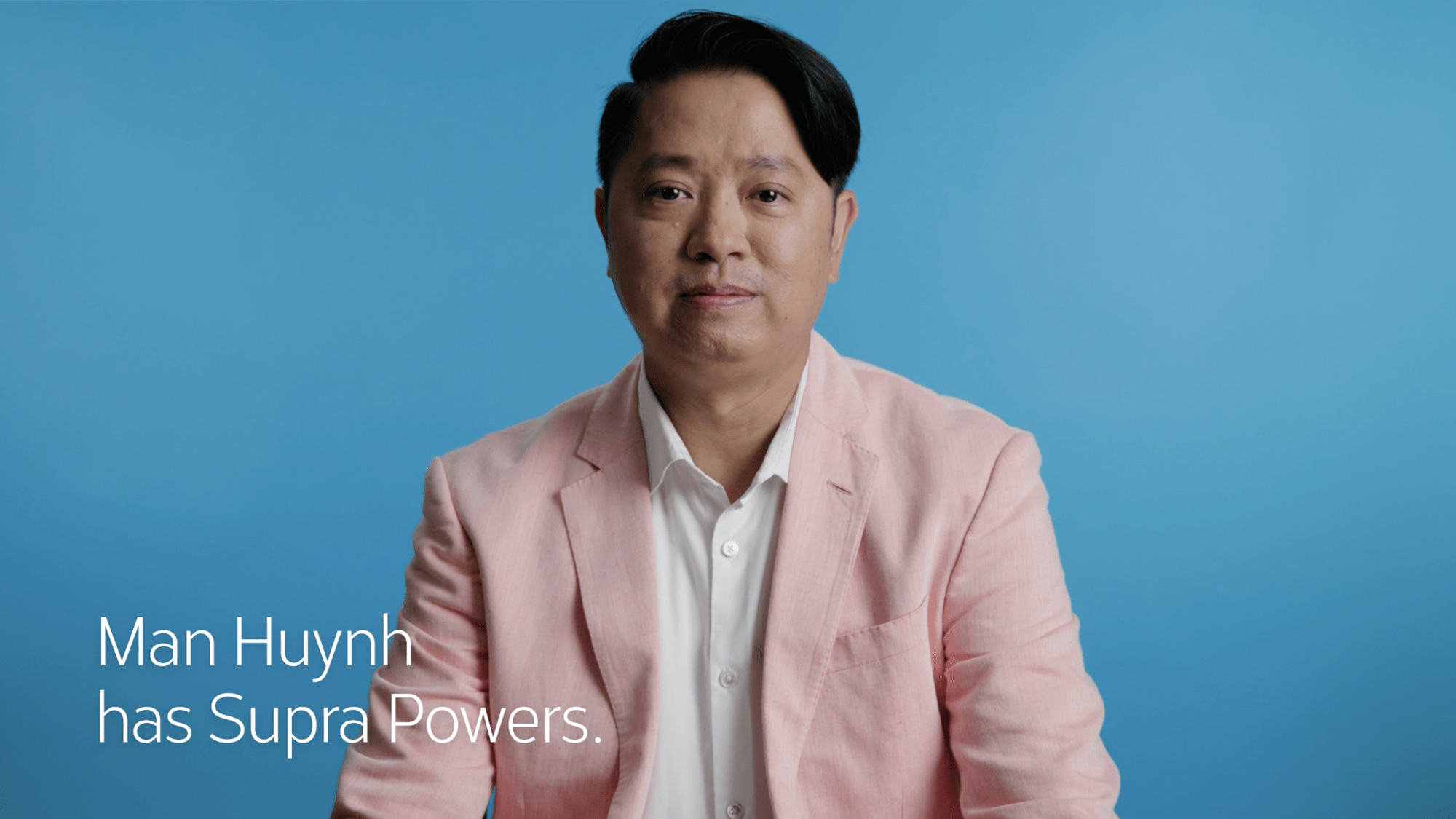 Close up of Asian American real estate agent Man Huynh with video caption