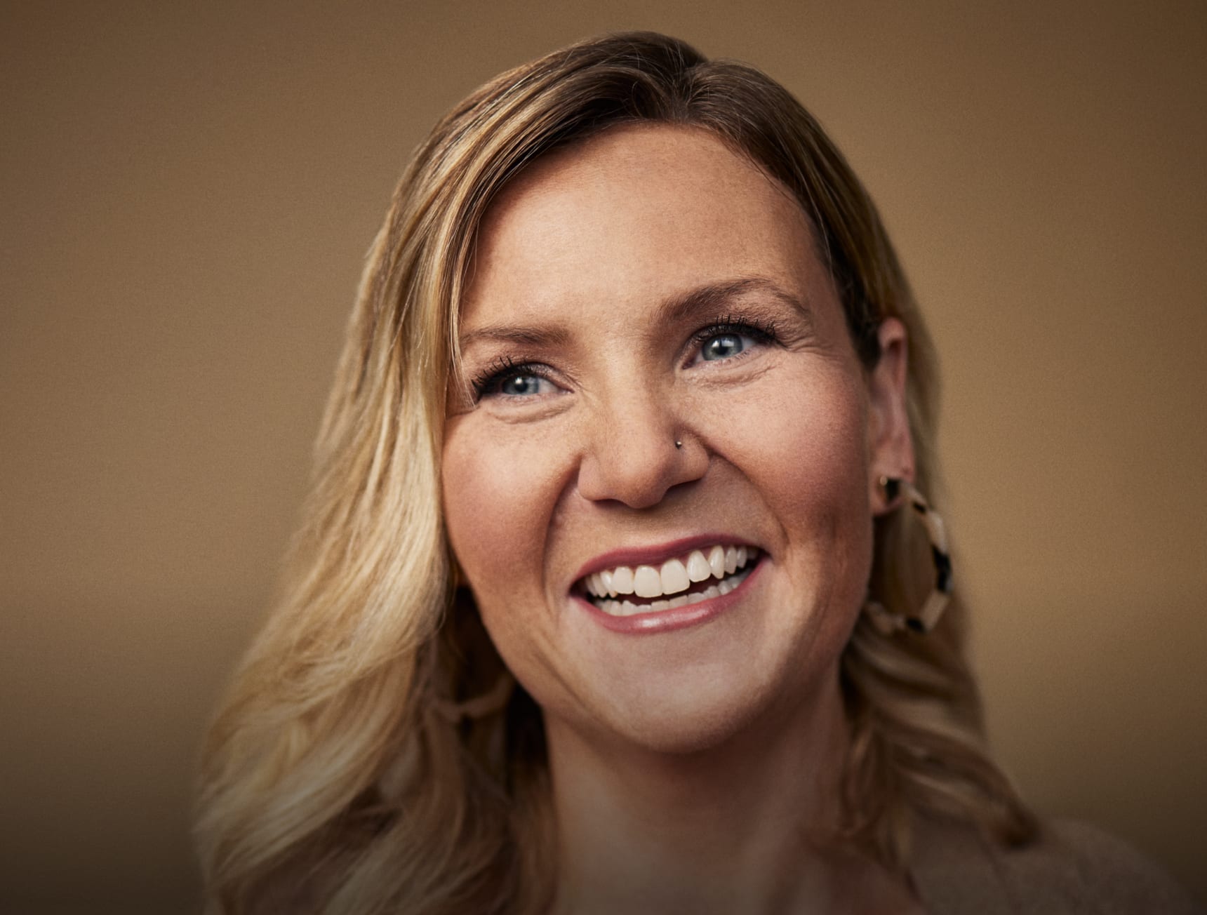 Close up of smiling female real estate agent Jennifer Ng with video caption schedules in a click of a button