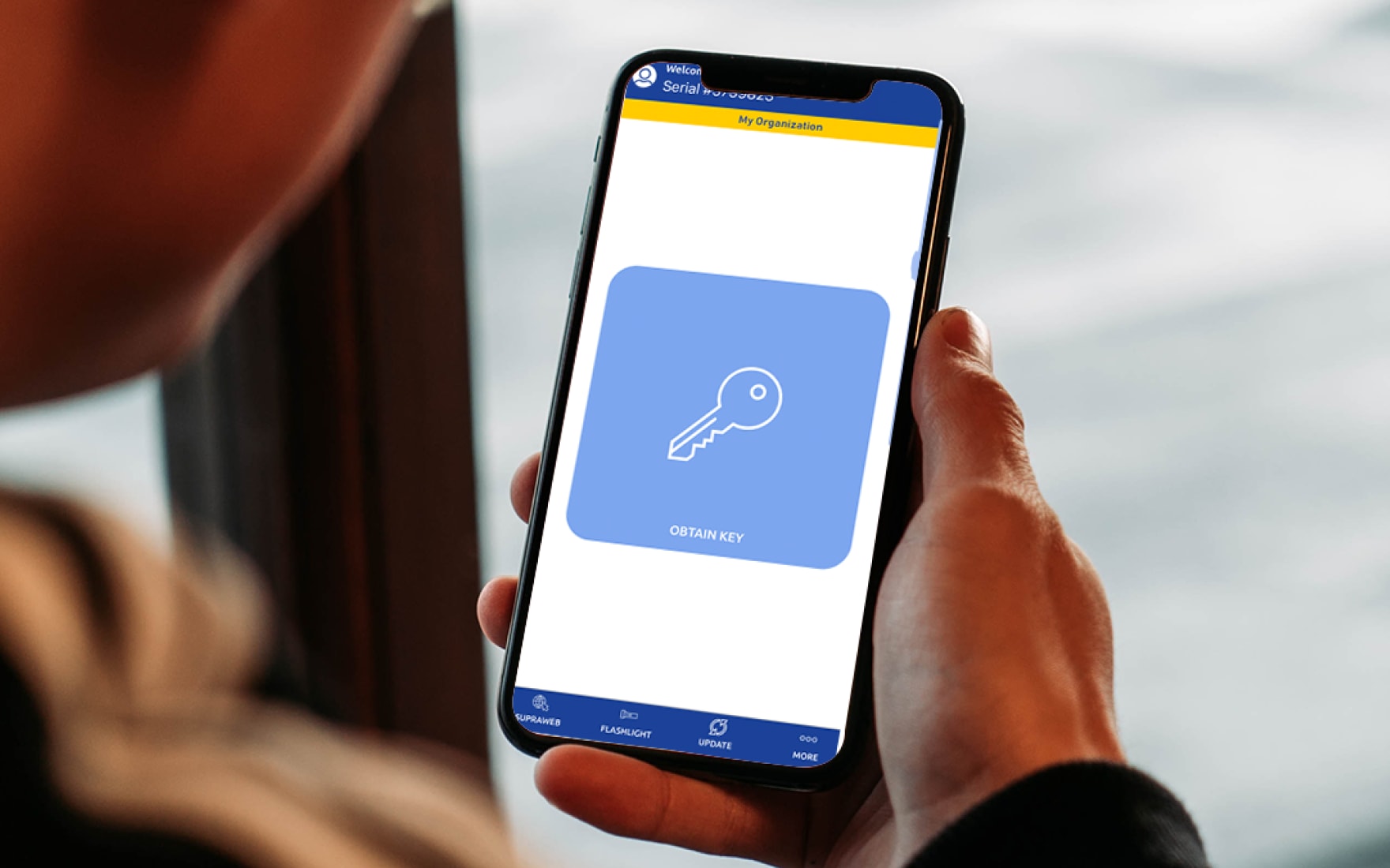 Supra eKEY app with large obtain key button for managed access on mobile phone.