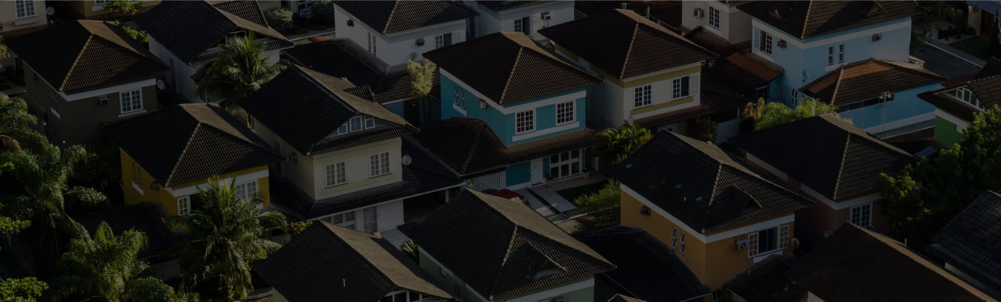 Aerial view of residential street with tall skinny homes with headline Get upgraded today