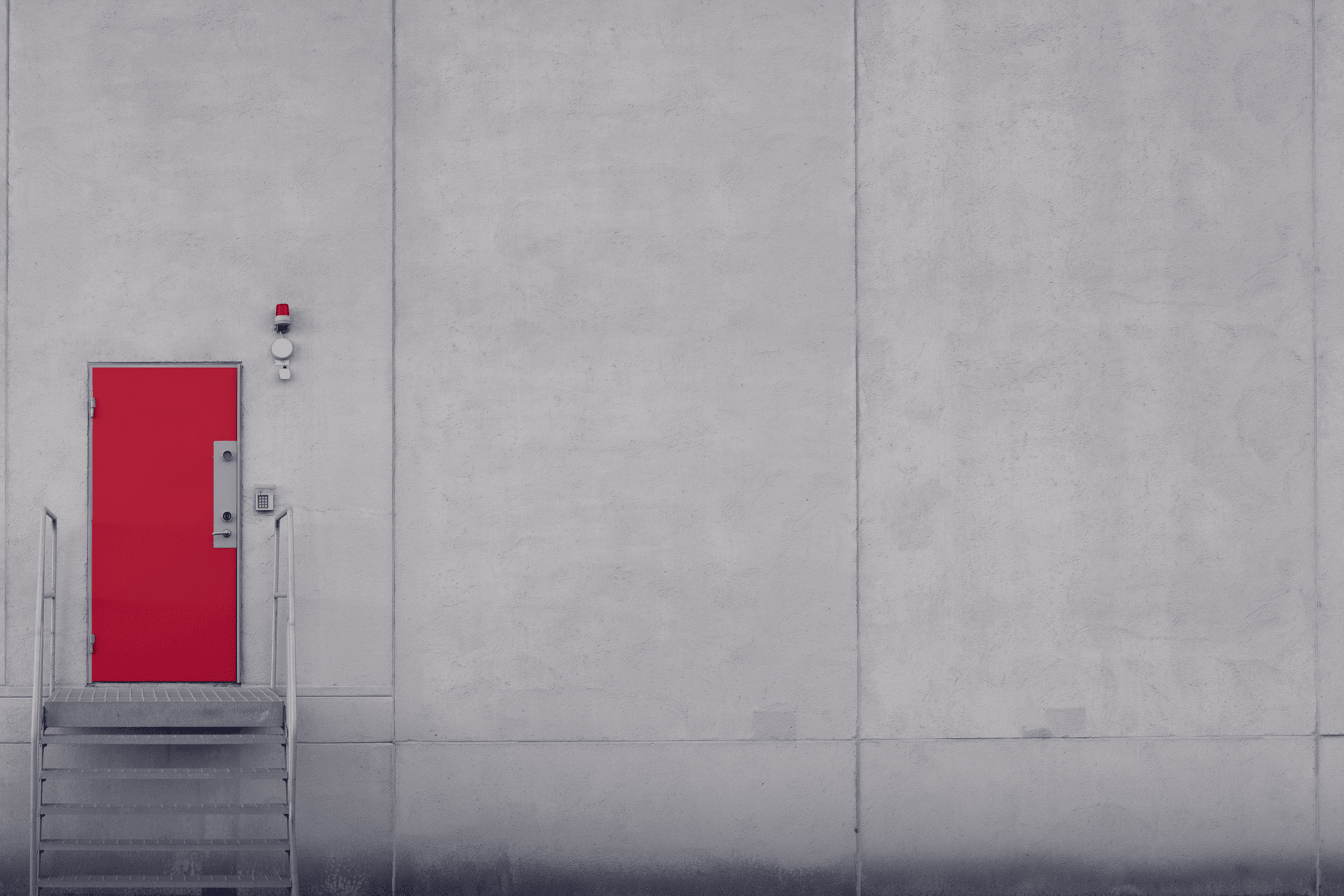 red-security-door-at-industrial-building-3x2