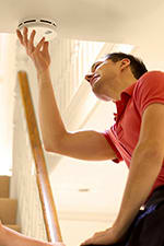 couple-installing-alarm-2x3