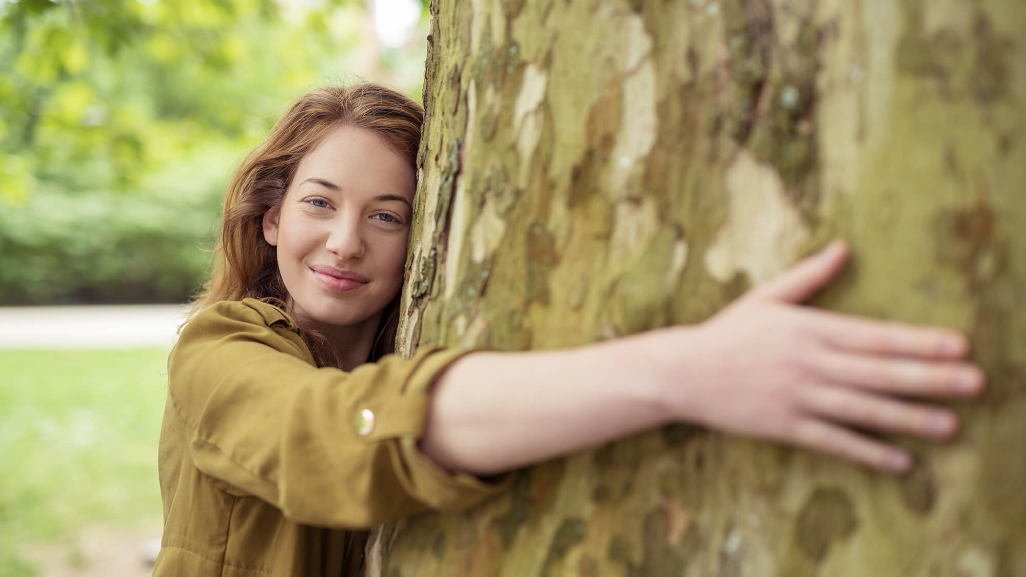young-woman-hugging-a-tree-h