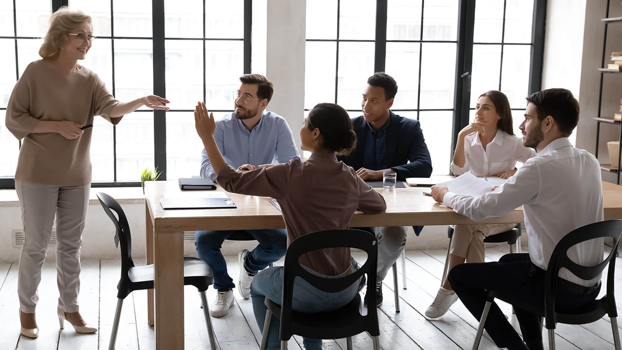 ciat-frequestly-asked-questions-woman-raising-hand-in-a-meeting-h