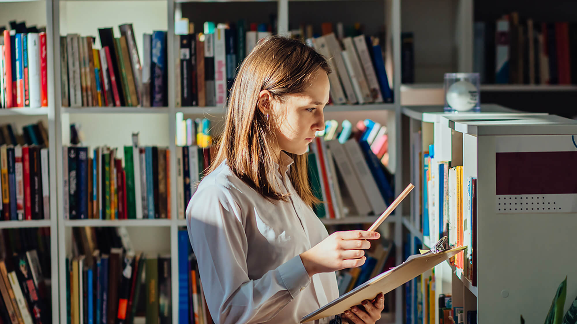 ciat-product-literature-woman-in-a-library-h