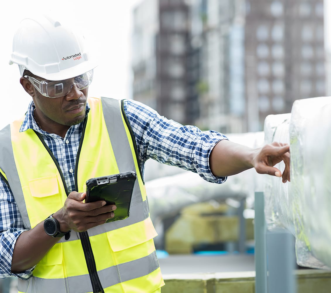 alc-tech-with-phone-and-equipment