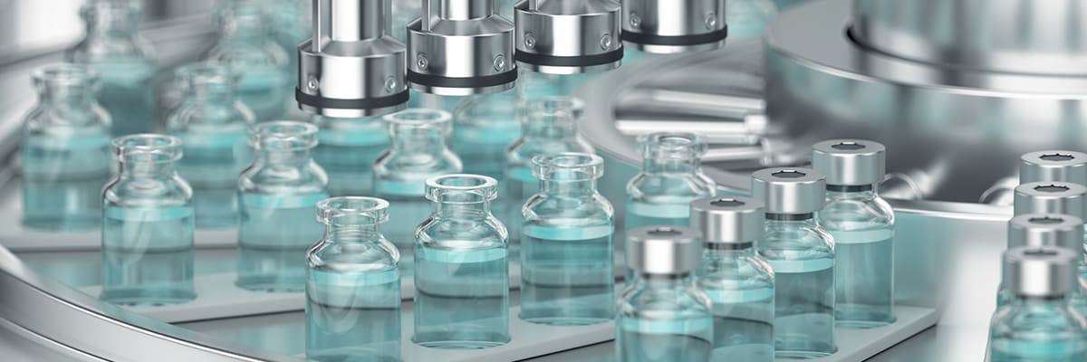 Vials of vaccines on a production line