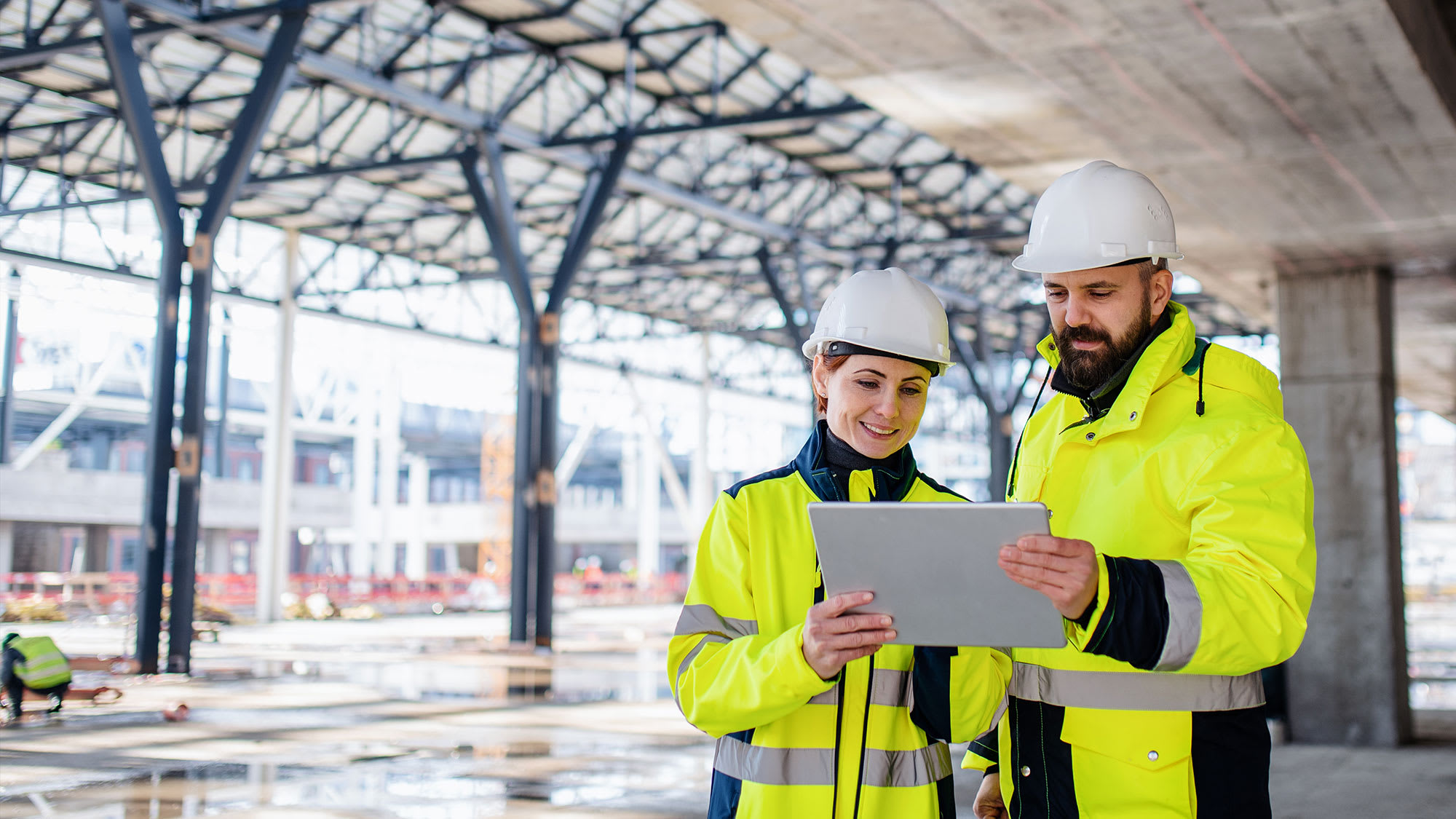 Engineers standing outdoors on construction site
